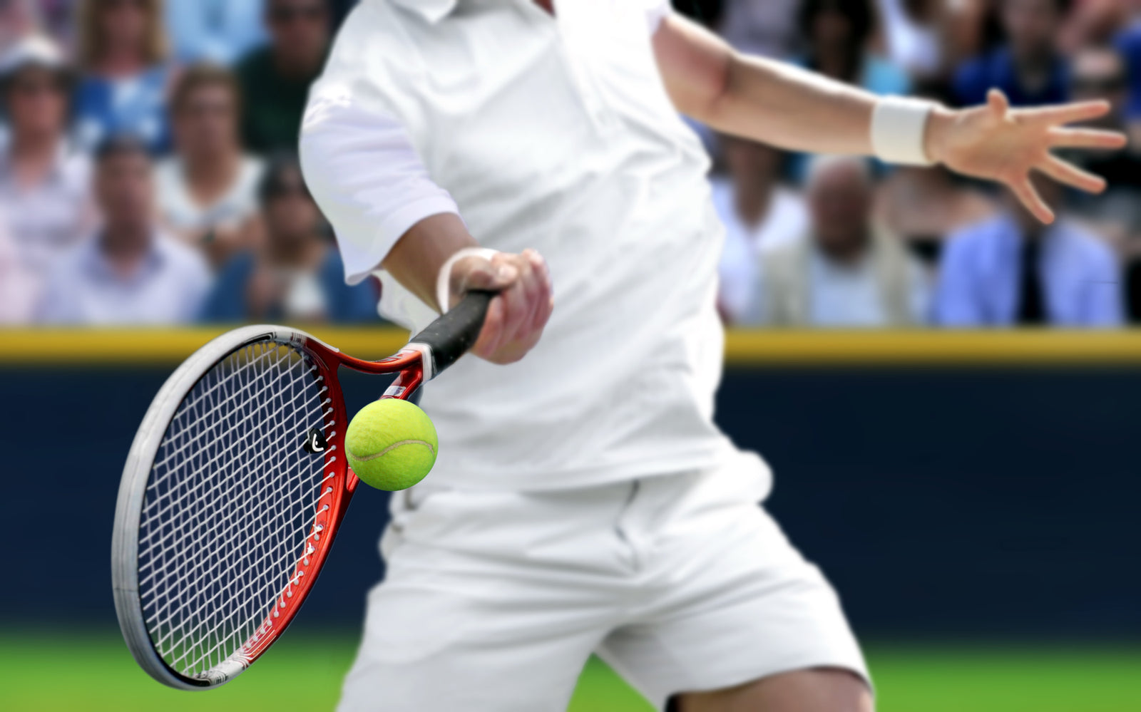 Tennis player hitting high-visibility green tennis ball with Redcat™ Eyewear LumiGlo™ lenses.