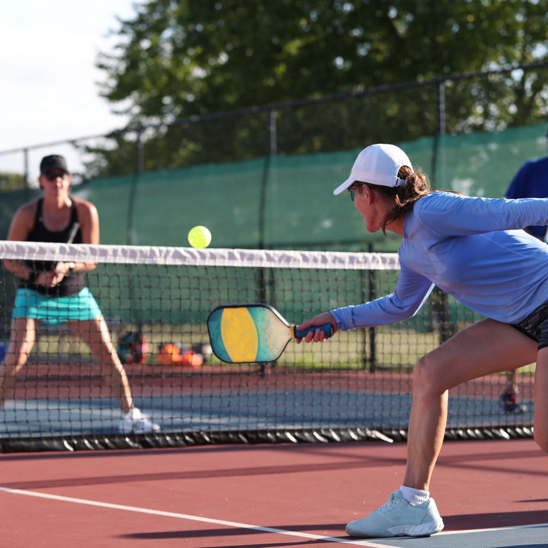 Redcat™ Eyewear's LumiGlo™ indoor and outdoor lenses with COLORBOOST™ amplify the hi-vis green pickleball color so it practically glows.