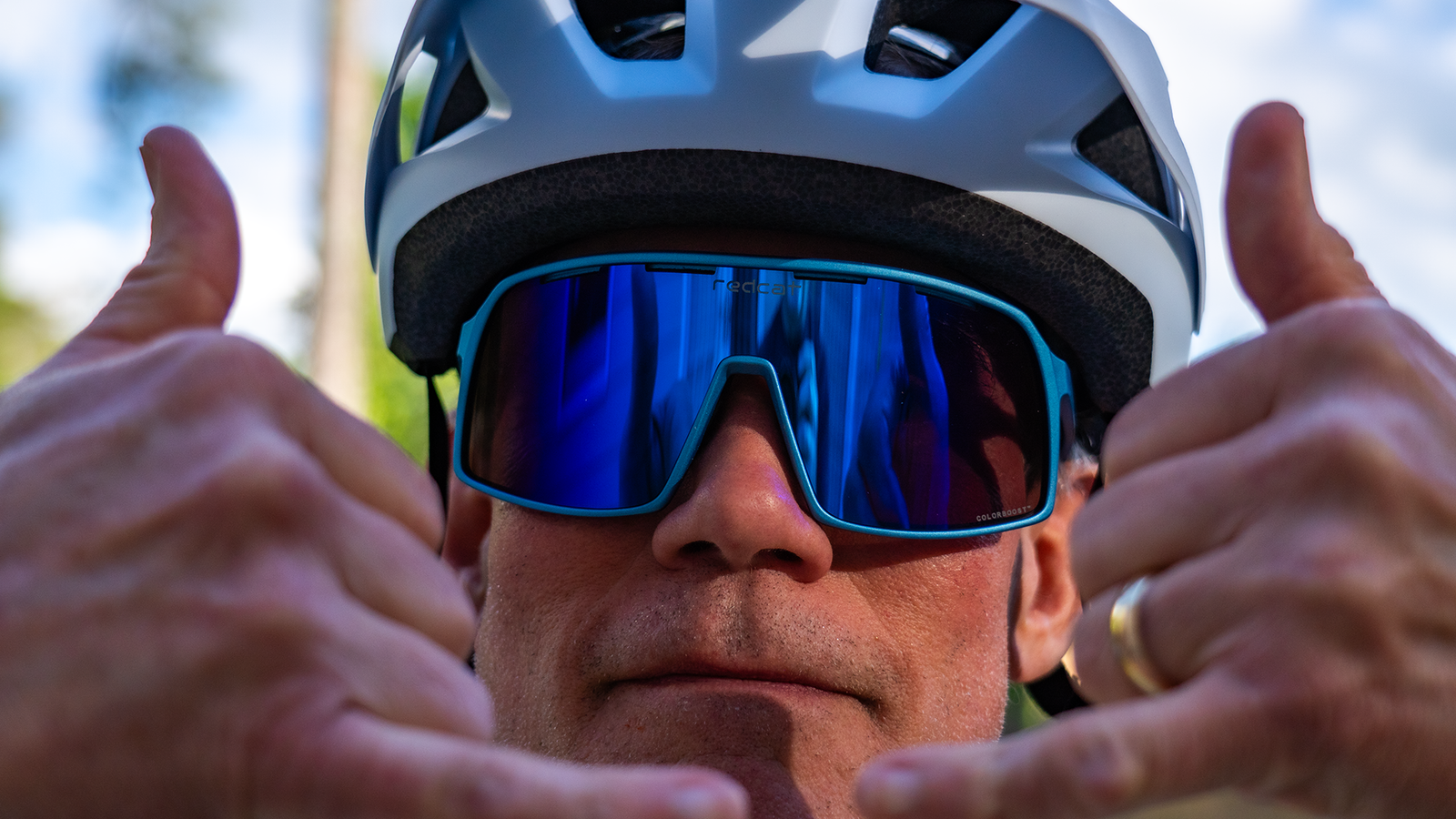 Mountain biker wearing Redcat™ Eyewear BEAST™ with CarbonGlo™ with Blue Blaze™ Mirror lenses.